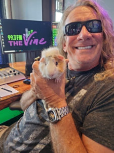 DJ holding guinea pig